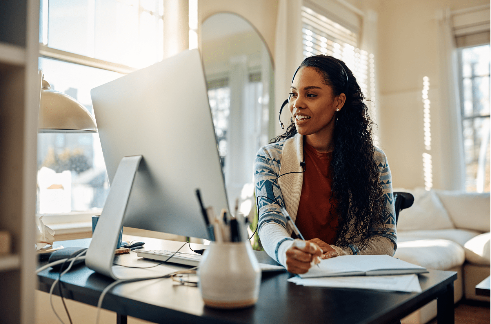 Woman researching on her computer how to improve employee engagement