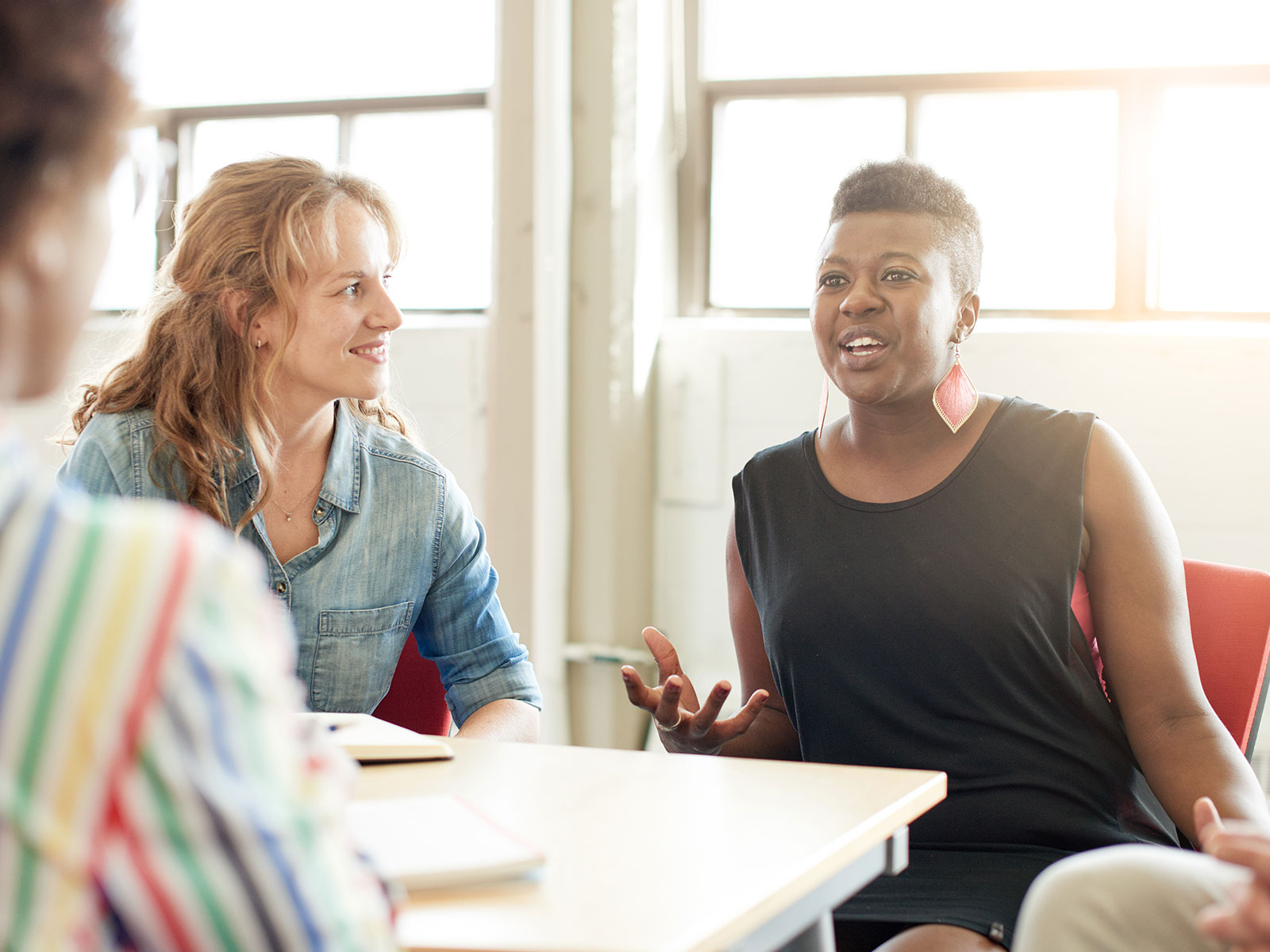 Women discussing menopause in the workplace